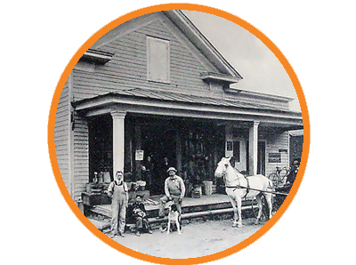 Vintage image of general store with a horse and people in front.